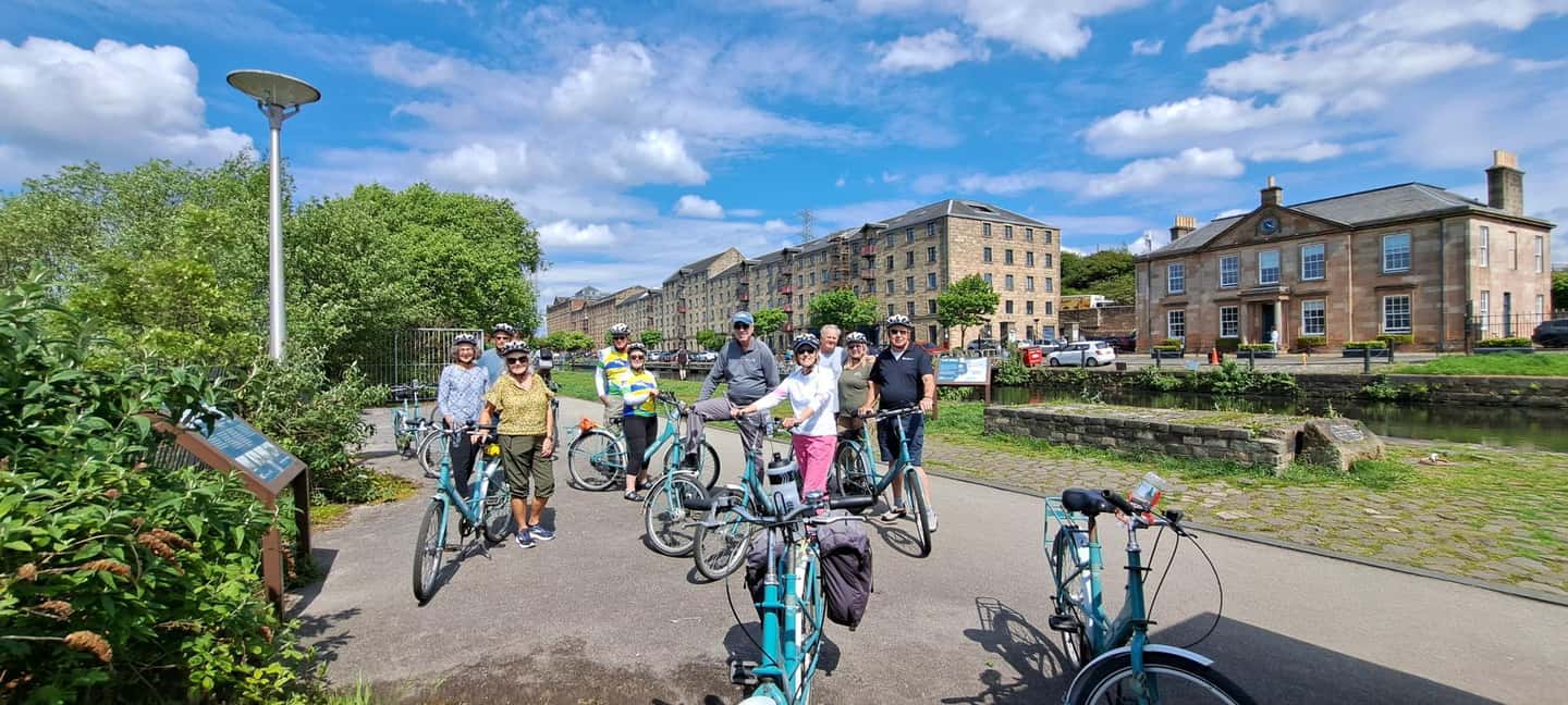 Glasgow: City, Green spaces and Clyde Bridges Bike Tour - Glasgow Bike Tour Basics: Postie Bikes, Helmets, and a 10-Person Group